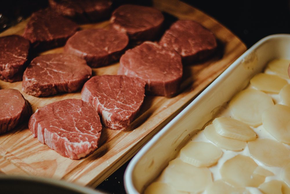 Thick premium eye fillet steaks in a butcher's tray