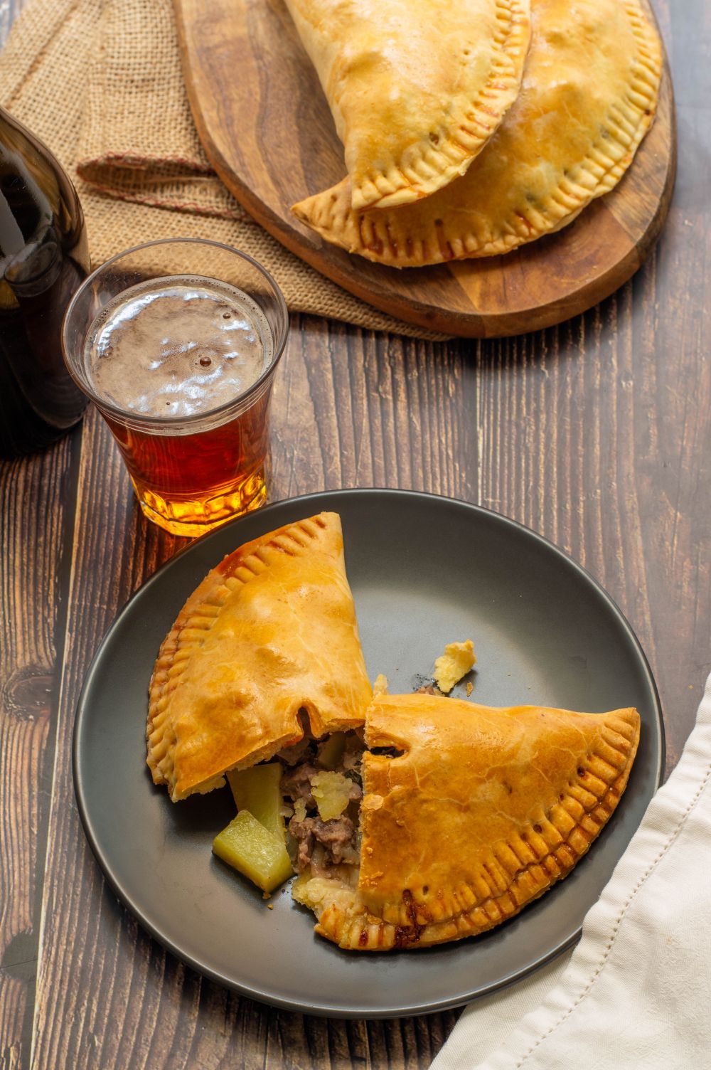 House-made golden meat pies on a serving plate